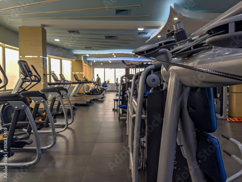 Modern gym equipment interior for weight loss and more healthy and active life for increasing strength and endurance