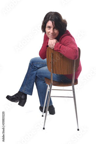 portrait of a woman sitting on a chair in white background photo