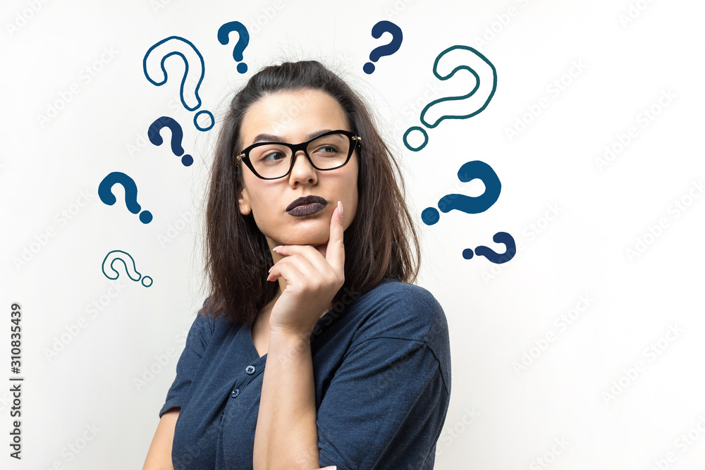 Image of excited young lady with glasses. Looking camera have an idea. Stands on a white background. Image of excited young lady with glasses. Looking camera have an idea. Stands on a white background.