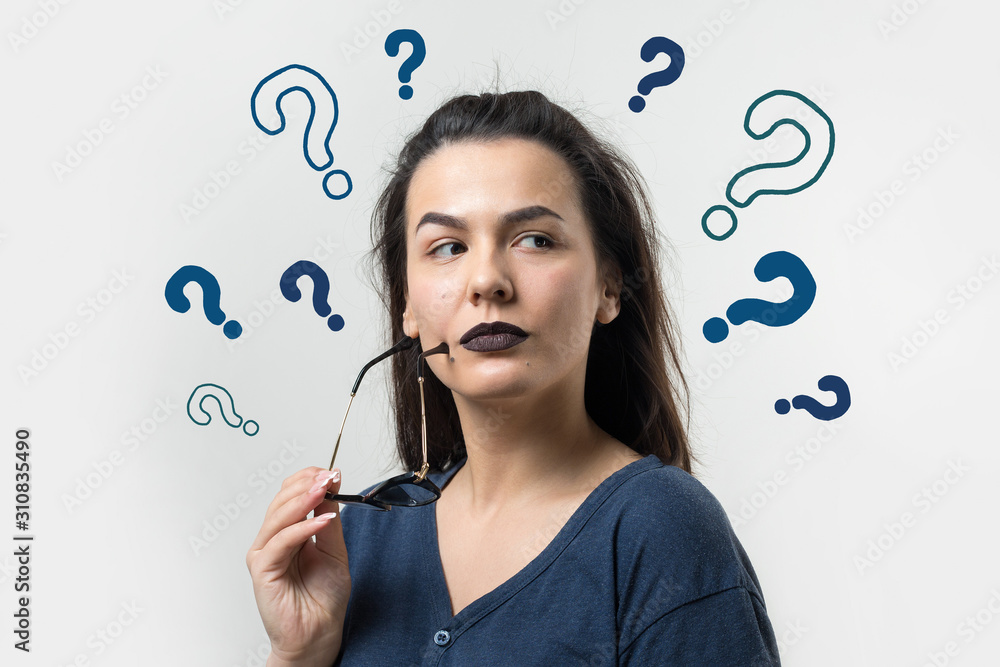 Image of excited young lady with glasses. Looking camera have an idea. Stands on a white background. Image of excited young lady with glasses. Looking camera have an idea. Stands on a white background.