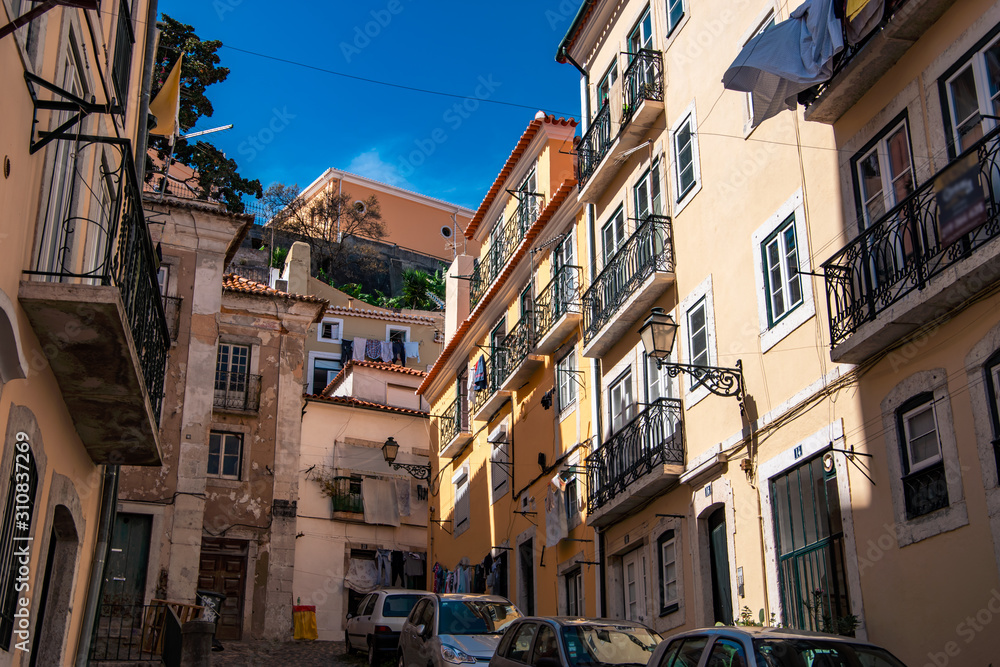 Charming narrow streets in Alfama district, Lisbon, Portugal