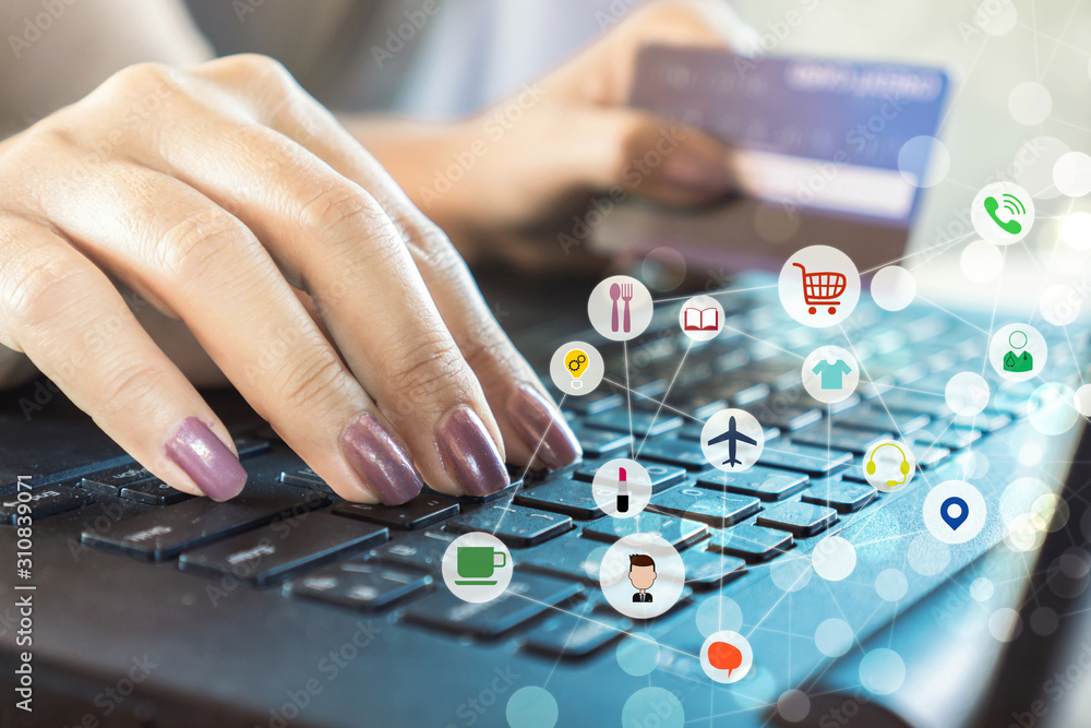 woman hand shopping online with credit card and typing on keyboard with technology icon background woman hand shopping online with credit card and typing on keyboard with technology icon background