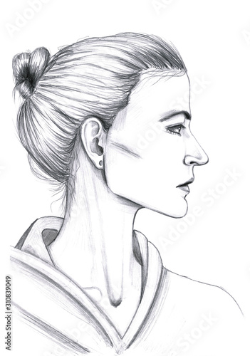 Fashion face profile portrait of young woman with hair bun in sports sweatshirt with hood