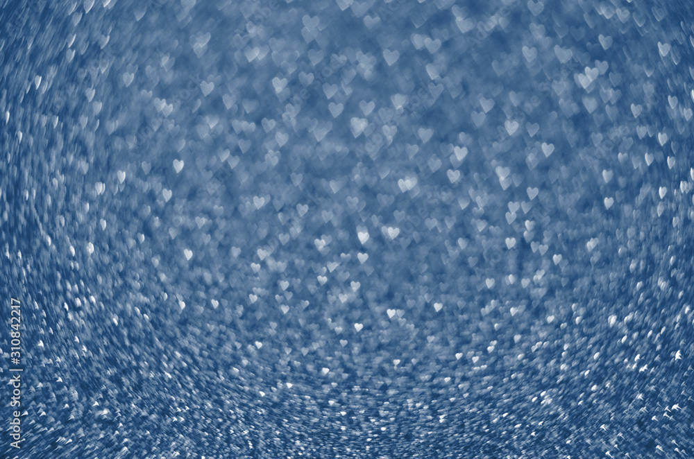Obraz premium Classic Blue color. Color of the year 2020. Abstract festive bokeh background with shining defocus sparkles. Blurred glitters shimmering dust macro close up, copy space for text logo