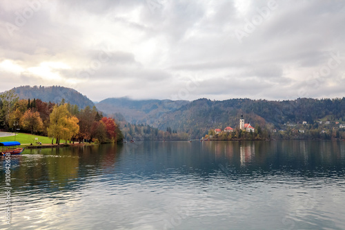 Autumn landscape with lake Bled and church in Slovenia at sunset
