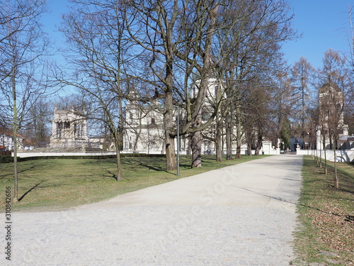 Path and collegiate church of Saint Anne in Wilanow quarter in european capital city of Poland photo