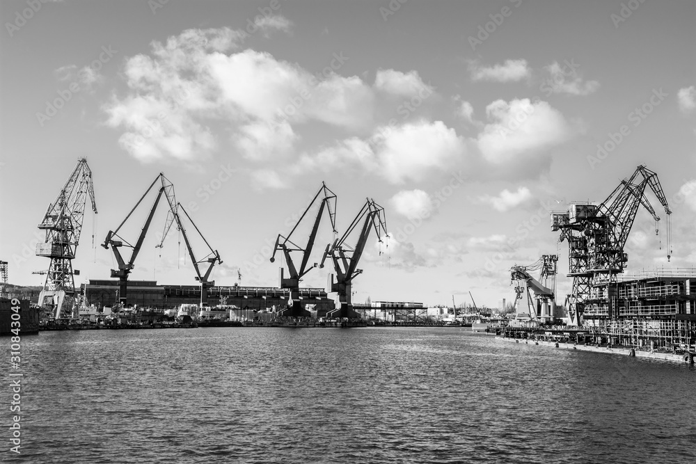 Big cranes and dock at the shipyard. Gdansk, Poland