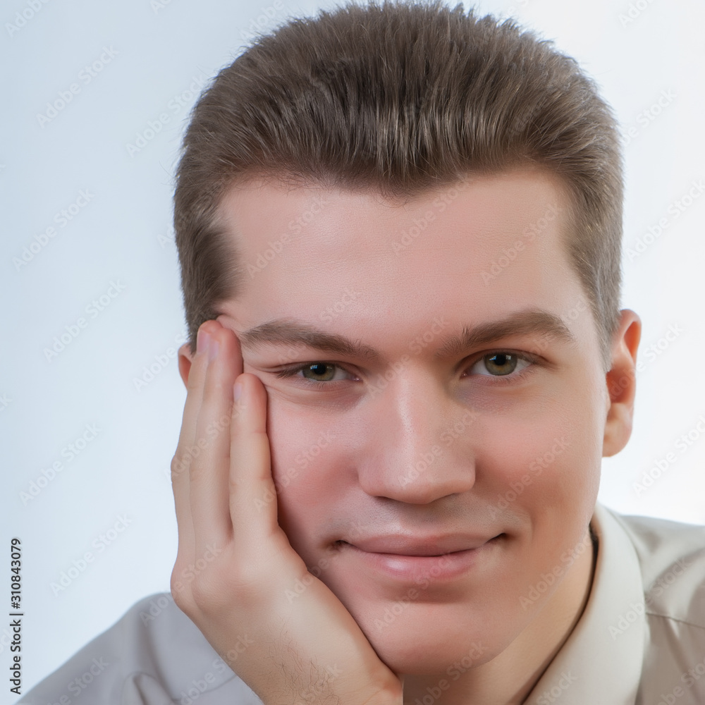 male manager looking at the camera smiling.