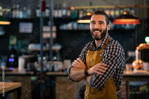 Bartender wearing apron and smiling photo