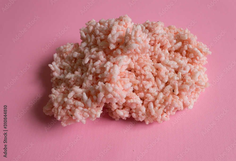 Rengginang (Indonesian snack) on pink background Rengginang (Indonesian snack) on pink background