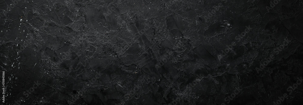 Black stone background. Stone texture. Top view. Free space for your text.