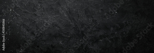Black stone background. Stone texture. Top view. Free space for your text.