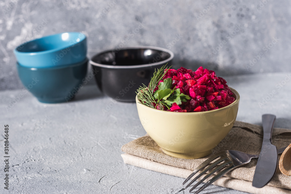 Food background. Christmas menu Beetroot salad - vinaigrette in a bowl, top view. Vegan cuisine. Diet menu Food background. Christmas menu Beetroot salad - vinaigrette in a bowl, top view. Vegan cuisine. Diet menu