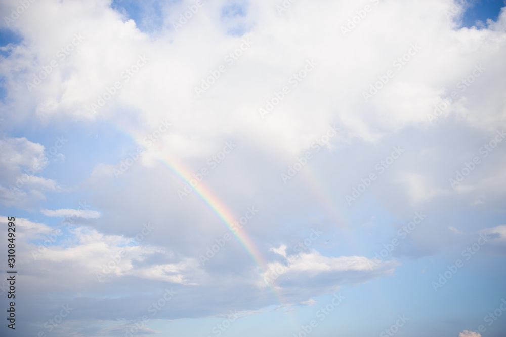Sky with clouds and rainbow after rain Sky with clouds and rainbow after rain