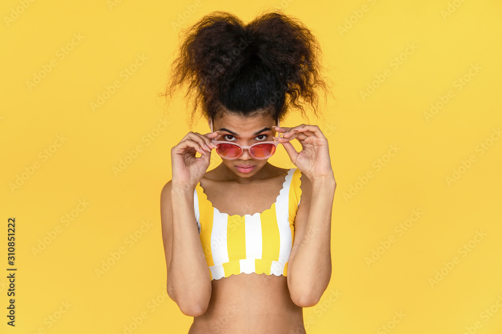 Fashion young african girl black woman afro hair wear stylish pink sunglasses  glasses looking at camera advertising eyeglasses sale isolated on summer  yellow studio background, portrait, copy space Stock Photo | Adobe