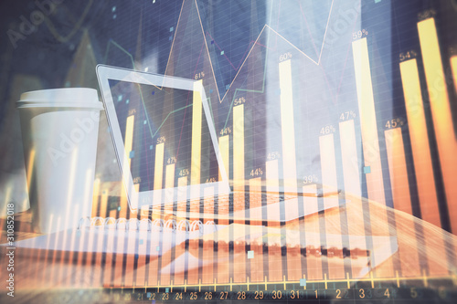 Forex Chart hologram on table with computer background. Multi exposure. Concept of financial markets.