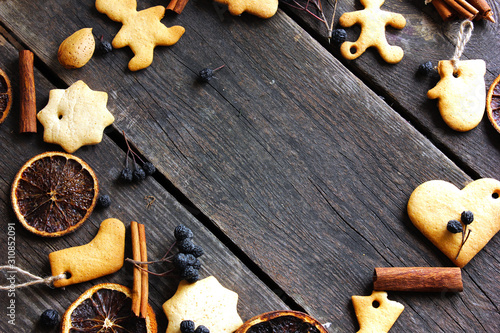 Christmas flat lay background with traditional gingerbread cookies. Festive flat lay X-mas or New year backgrund