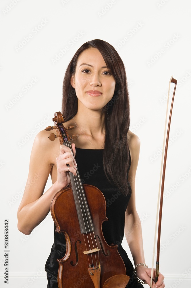 Female Standing With Fiddlestick And Violin Female Standing With Fiddlestick And Violin