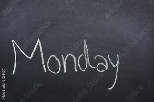 Day of the week written on a blackboard with white chalk, Monday