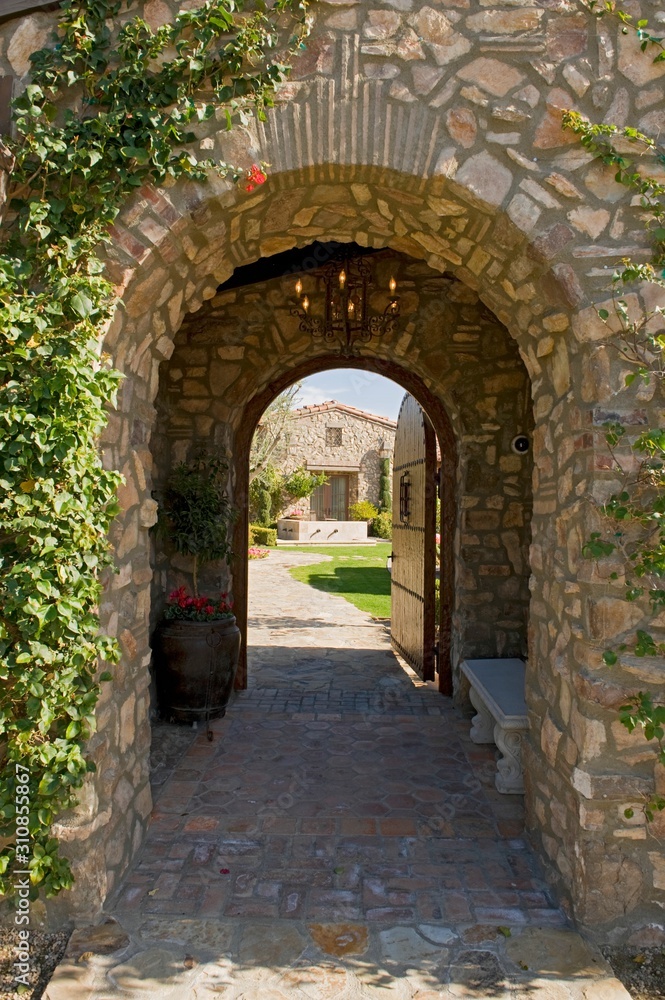 Arched Walkway With Open Door