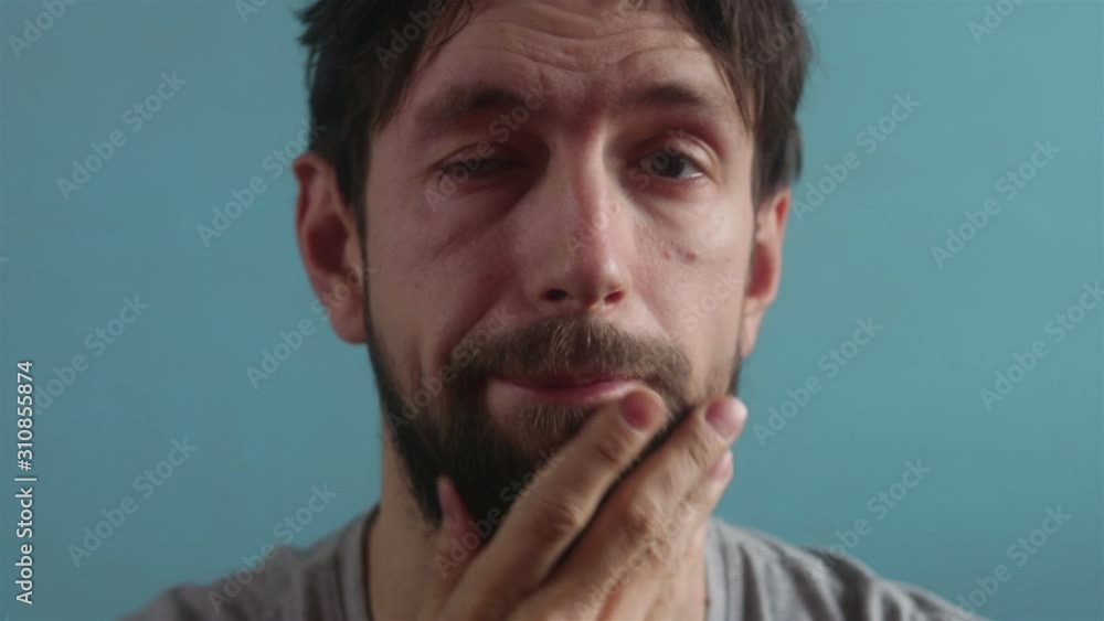 bearded sleepy shaggy man face emotion close up bearded sleepy shaggy man face emotion close up