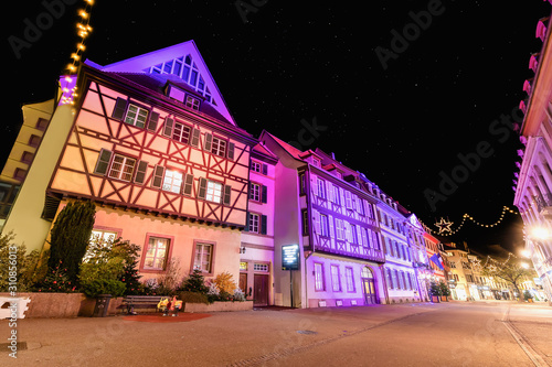 Traditional Alsatian half-timbered housesin Petite Venise or little Venice, old town of Colmar, decorated and illuminated at christmas time, Alsace, France photo