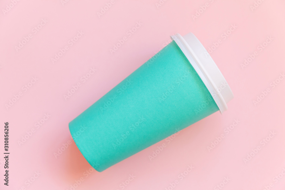 Simply flat lay design blue paper coffee cup on pink pastel colorful trendy background. Takeaway drink container. Good morning wake up awake concept. Template of drink mockup. Top view copy space Simply flat lay design blue paper coffee cup on pink pastel colorful trendy background. Takeaway drink container. Good morning wake up awake concept. Template of drink mockup. Top view copy space
