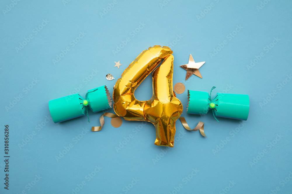 Christmas countdown. Gold number 4 with festive cristmas cracker decorations