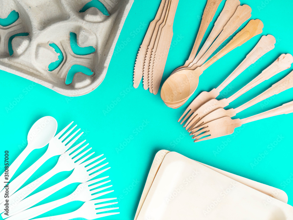 Fototapeta premium Eco-friendly biodegradable paper dishes on a neon blue background