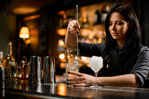 Wallpaper Mural Bartender stirring ice with a bar spoon Torontodigital.ca