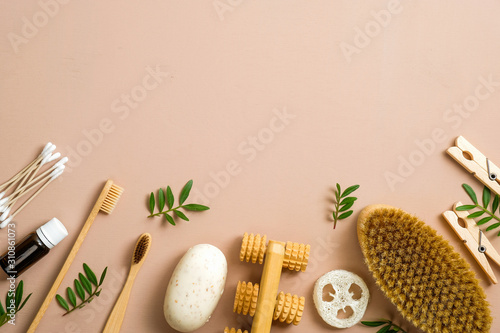 Natural bathroom accessories, organic spa and beauty treatment products. Zero waste, plastic free concept. Flat lay homemade soap, bamboo toothbrush, wooden pins, luffa sponge, ear sticks, spa brush.
