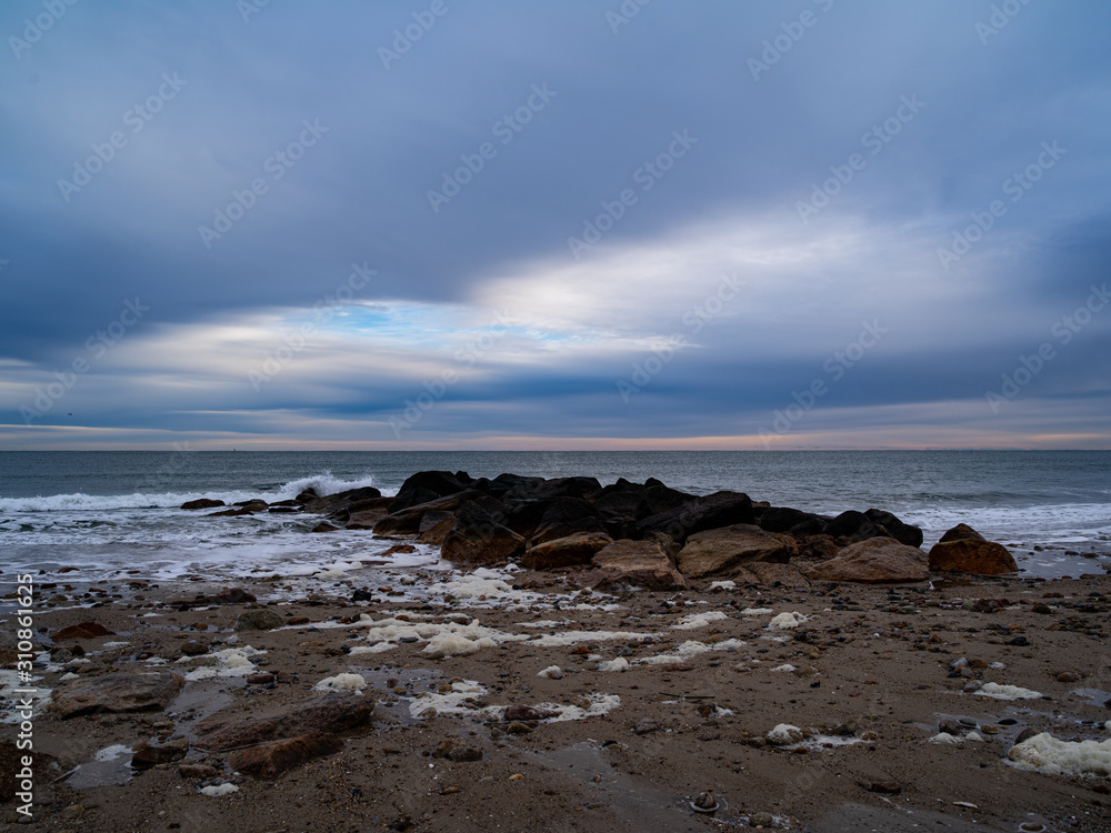 Fototapeta premium A Small Breakwater On A Beach In Sandwich Massachusetts