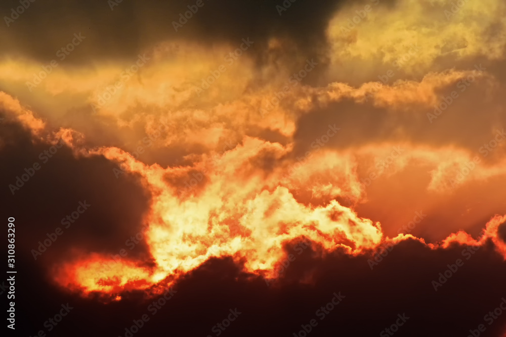 Fototapeta premium orange sky or blast sky or The explosion cloud sky or Spiritual sun rays through the clouds or Optimistic sunset rays