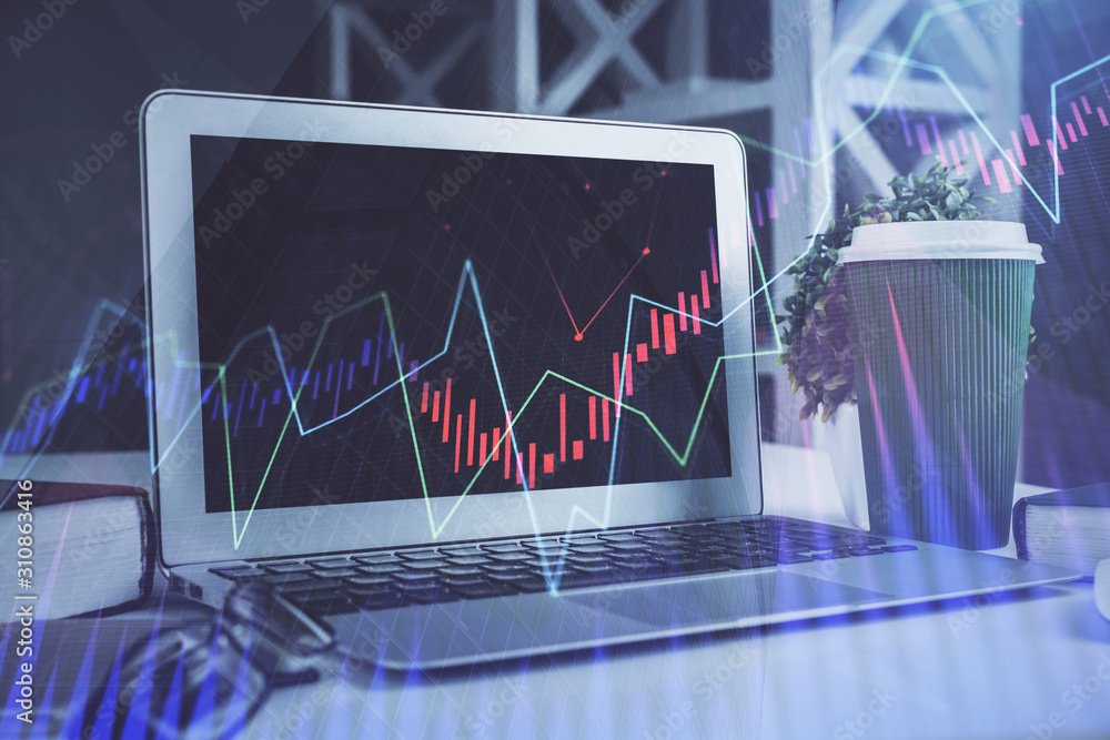 Stock market chart hologram drawn on personal computer background. Double exposure. Concept of investment. Stock market chart hologram drawn on personal computer background. Double exposure. Concept of investment.