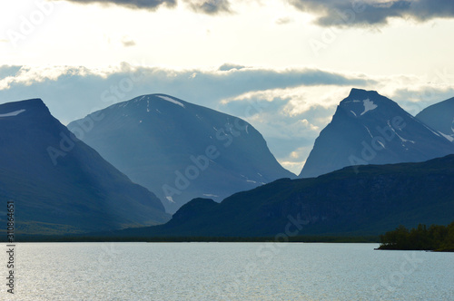 Big clouds over the biggest swedish mountains, kebnekaise valley in Sweden near Nikkaluokta photo