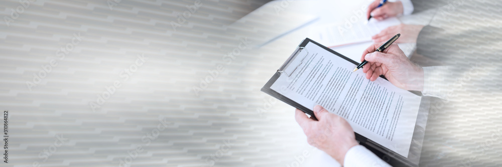 Businesspeople taking notes; panoramic banner Businesspeople taking notes; panoramic banner