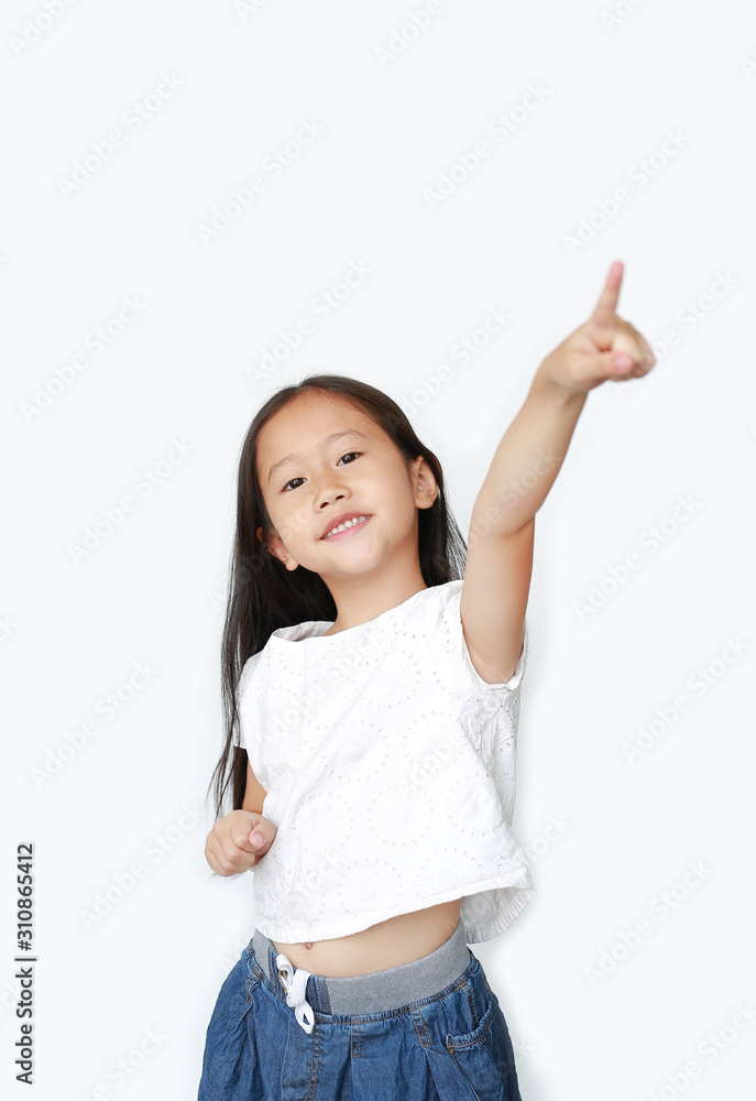 Portrait of happy little child girl poiting up and looking at camera isolated over white background. Portrait of happy little child girl poiting up and looking at camera isolated over white background.