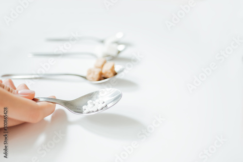 Different types of sugar with sugar substitute on a white background, copy space. Diabetic concept 