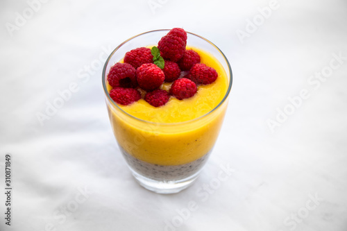 Chia pudding and Mango smoothie with raspberry topping