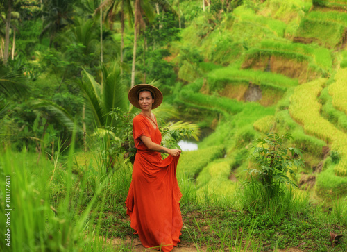 Woman walking on Tegalalang Rice Terrace, Bali photo