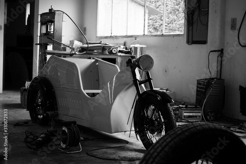 Old vehicul three wheel repair garage vintage collector photo