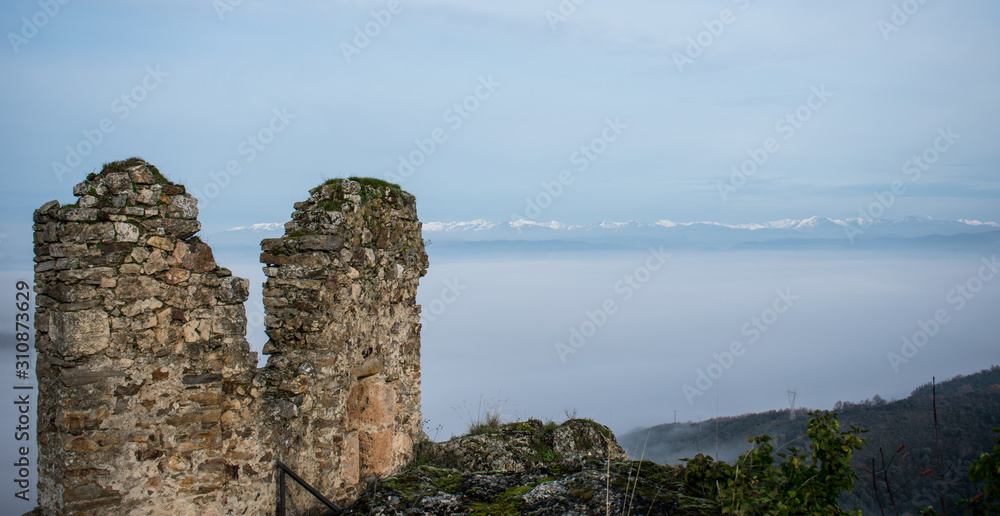 ruins of a castle on the top of the mountain