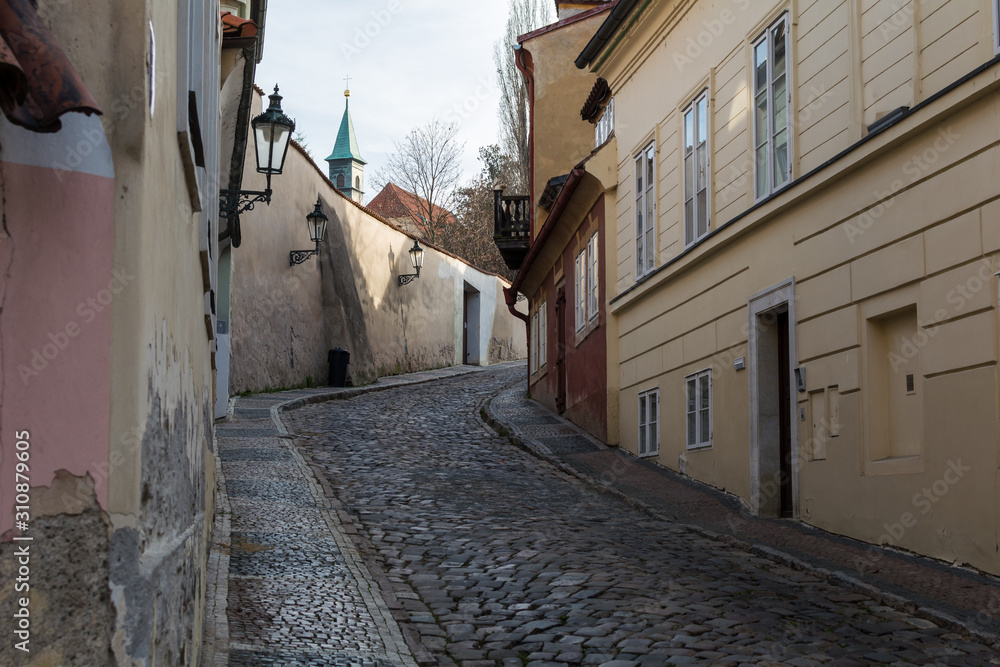 Narrow stone street going up  in old town of Prague