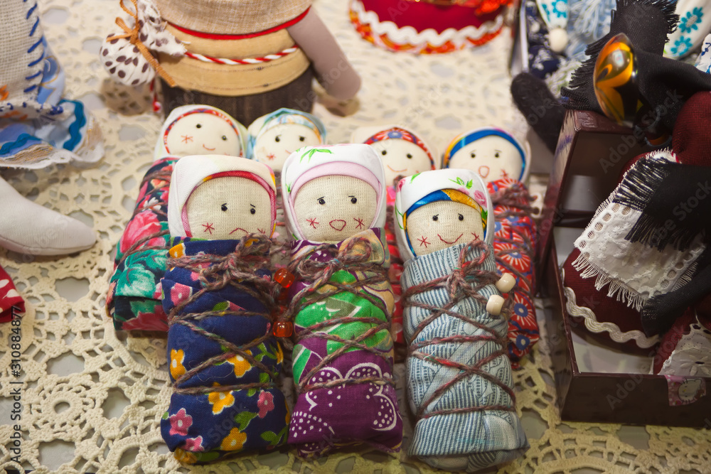 Little dolls wrapped in cloth. Handmade. Hobby.