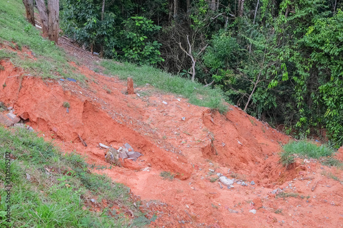 Drain damage. Soil erosion or landslide  in the slope  during  the rainy season at Muadzam Shah, Malaysia. photo