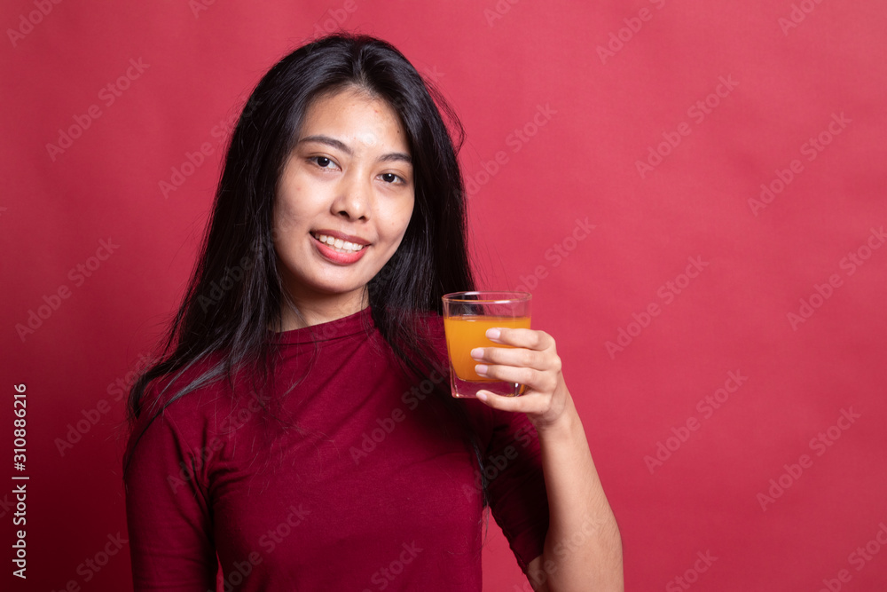 Young Asian woman drink orange juice. Young Asian woman drink orange juice.