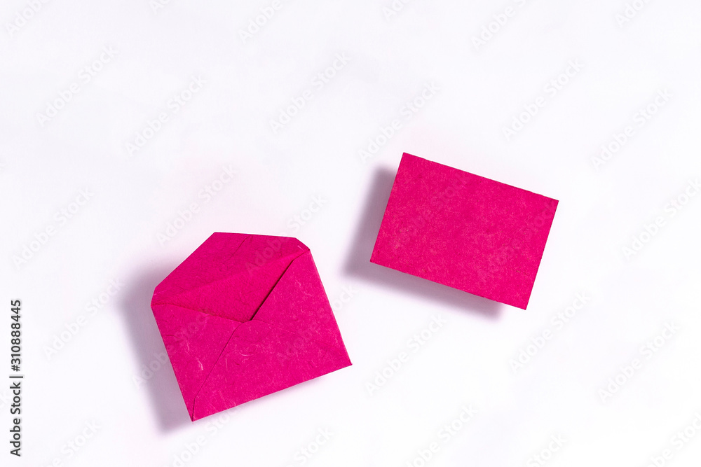 Valentine's day composition. Purple envelope on white paper background. Letter with love concept. Flat lay, top view, copy Valentine's day composition. Purple envelope on white paper background. Letter with love concept. Flat lay, top view, copy
