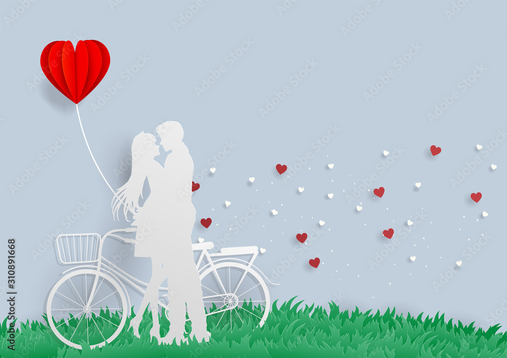 Young man hug his lover with bicycle and red heart balloon on green grass feeling happy love.Marry me.valentine.