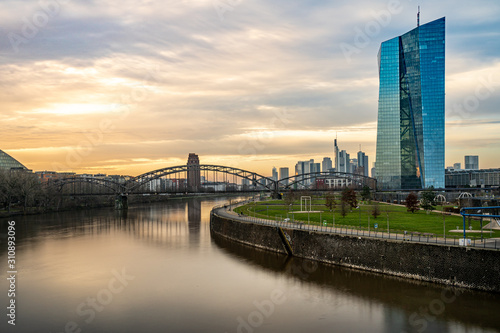 frankfurt skyline at sunset with colorful reflections in the main river, frankfurt am main, germany