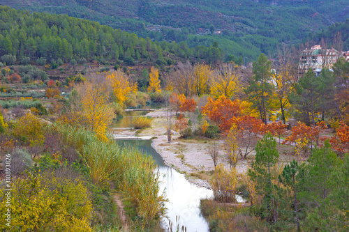 Park with thermal springs in Montanejos, Spain. A view on the park from above in autumn.